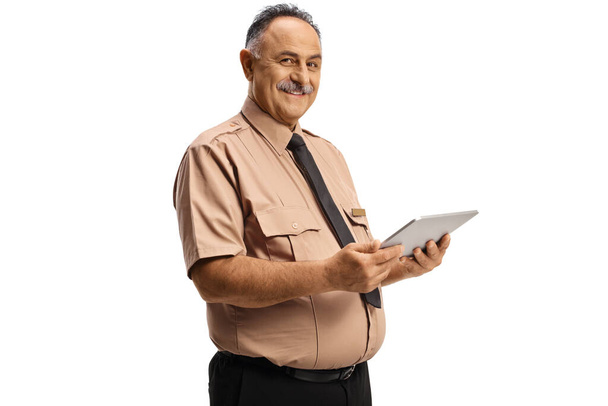 Smiling mature security officer using a digital tablet isolated on white background - Foto, Imagem