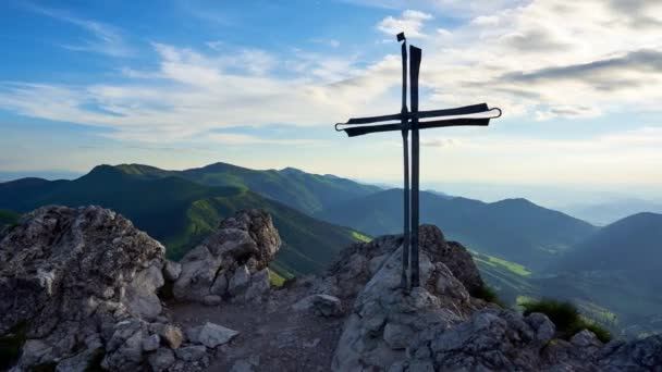  Iron cross on a rocky hill in the summer landscape at sunset. It represents God, faith, hope, power and salvation. This video has 4k timeline. Ideal for religious events and promotions. - Footage, Video