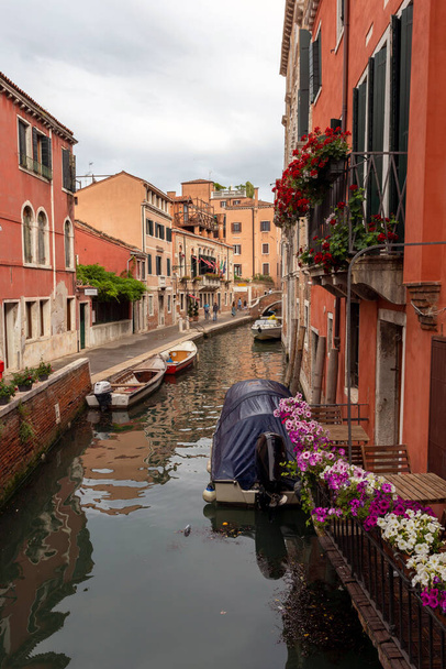 Venice, Italy - 06 09 2022: Narrow canal in the city of Venice on a summer day. - Photo, Image