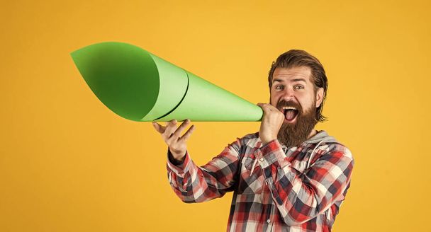 stylish bearded guy with trendy hairstyle wear checkered shirt with paper speaker, speak. - Φωτογραφία, εικόνα