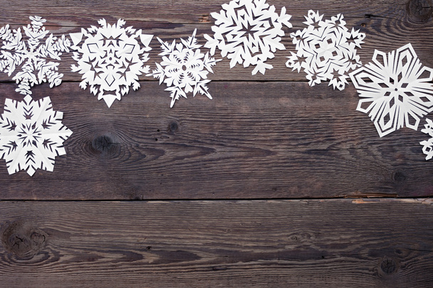 Weihnachtsbordüre - Holzhintergrund mit Schneeflocken - Foto, Bild