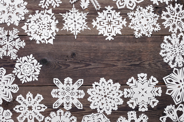 Christmas frame - wooden background with snowflakes - Photo, Image