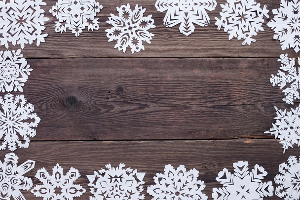 Christmas frame - wooden background with snowflakes - Foto, Imagem