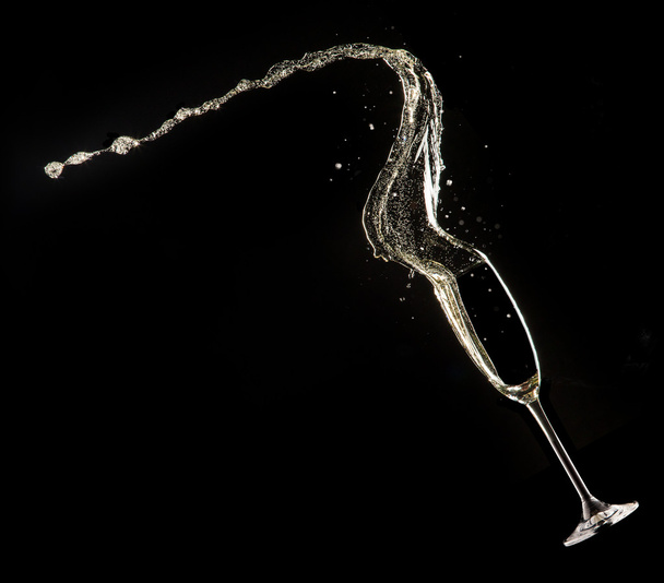 Glass of champagne on black background - Fotografie, Obrázek