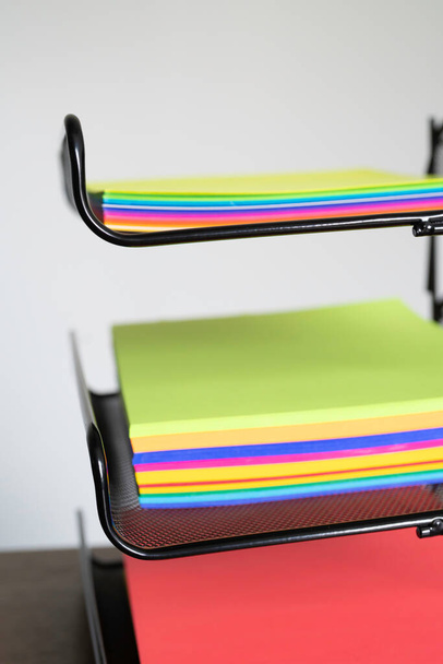 stack of documents on brightly colored paper on office table - Fotó, kép