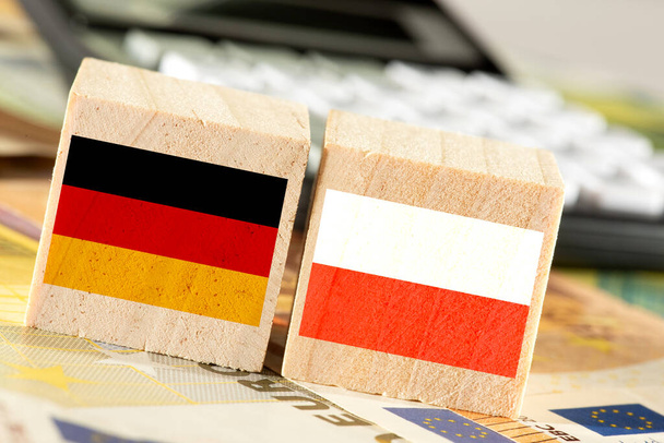 Zászló Németország és Lengyelország, euró pénz és számológép - Fotó, kép