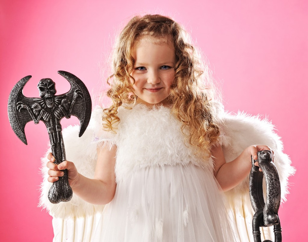 Beautiful little angel with an axe - Photo, Image