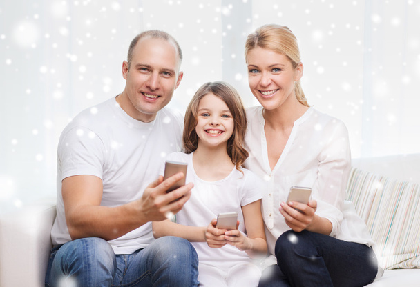 happy family with smartphones at home - Фото, изображение