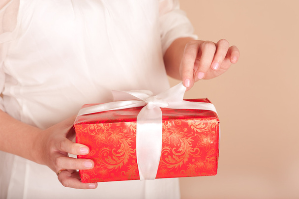 Female hands with present box - Foto, imagen