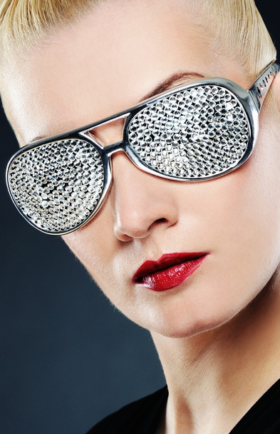 Close-up portrait of a beautiful woman in stylish glasses - Photo, Image