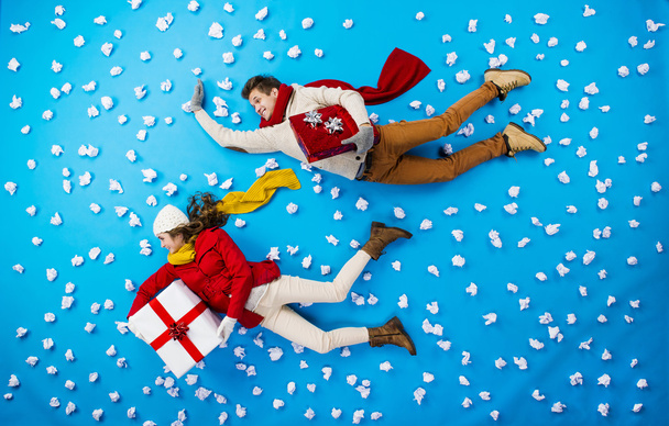 Christmas couple lying - Foto, afbeelding