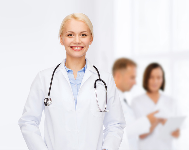 smiling female doctor with stethoscope - Фото, зображення