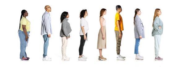Profile view of young men and women standing in front of each other isolated over white background, Horizontal flyer. Models in casual clothes. Work, study, team, fashion, diversity, human rights - Foto, Imagem