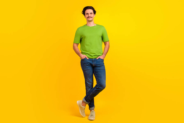 Full size portrait of confident young person put arms pockets posing isolated on yellow color background. - Photo, Image