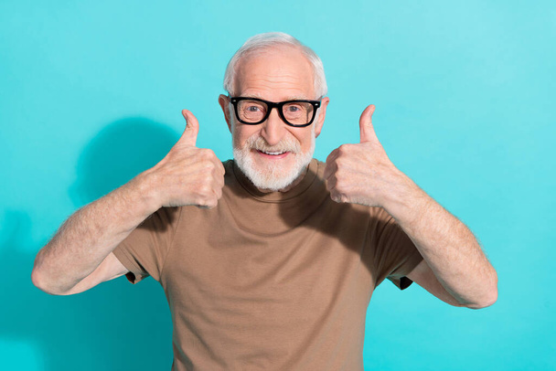 Portrait of attractive cheerful grey-haired man showing double thumbup ad trust isolated over bright blue color background. - Photo, Image