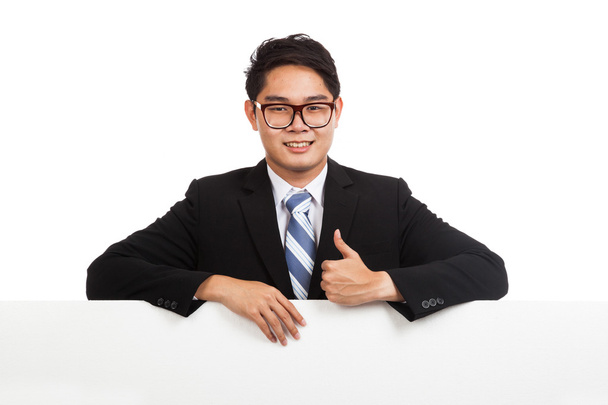 Asian businessman thumbs up behind blank banner - Foto, Imagem