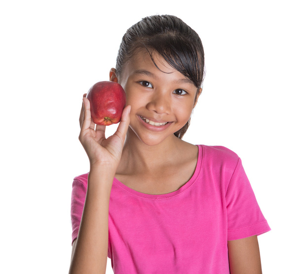 Giovane ragazza con una mela rossa
 - Foto, immagini