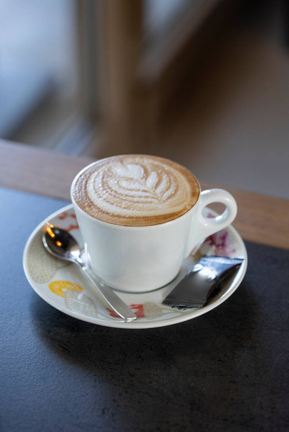 Cappuccino with a heart latte art - 写真・画像