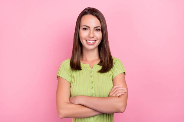 Photo of cool brunette young lady crossed arms wear green top isolated on pink color background. - Fotografie, Obrázek