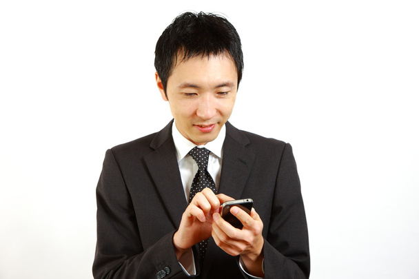 Japanese businessman with smartphone - Foto, immagini