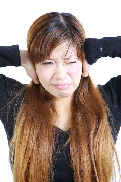 Young Japanese woman suffers from noise　 - Photo, Image