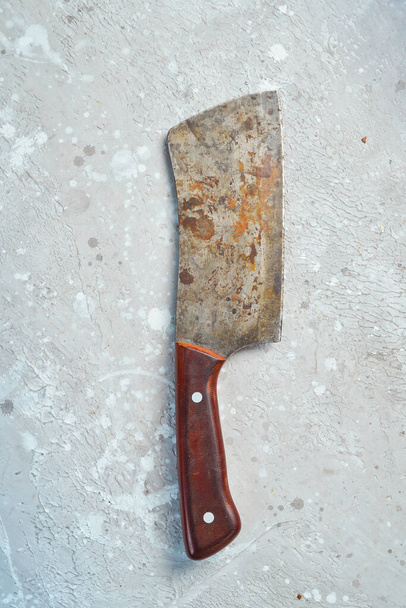 Old knife. Kitchen metal knife. Top view. On a stone background. - Фото, изображение