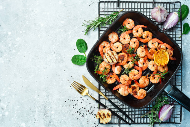 Grilled prawns grilled with lemon and garlic. On a stone background. - Photo, Image