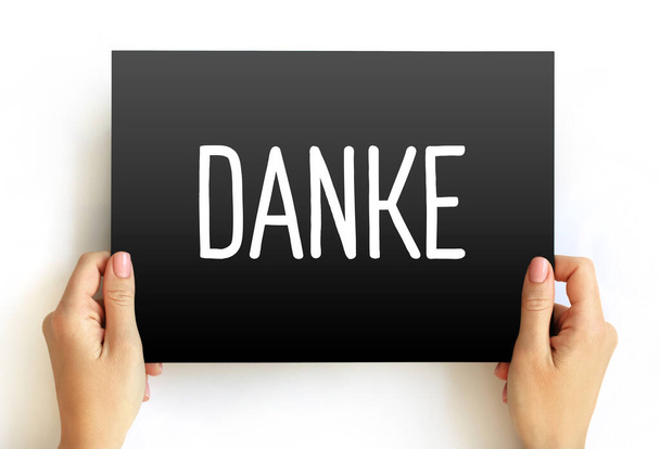 Danke (thank you in german) text on card, concept background - Foto, afbeelding