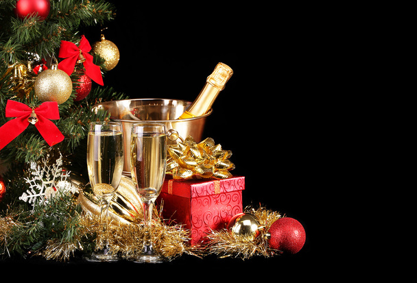Christmas or New Year's Eve. Champagne and Presents over Black - Foto, imagen
