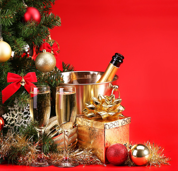 Christmas or New Year's Eve. Champagne and Presents over Red - Photo, Image
