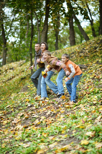 Happy family in autumn park - Zdjęcie, obraz