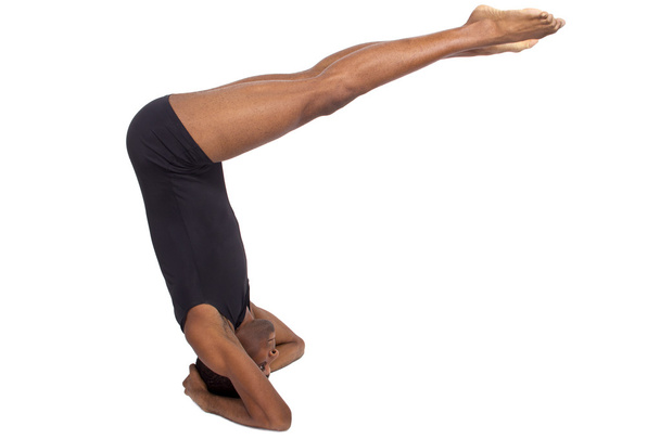 Man doing upside down yoga - Fotografie, Obrázek