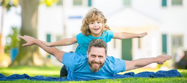 Banner of father and son in summer park outdoor. happy father and son having fun in park. family value. childhood and parenthood - Photo, Image