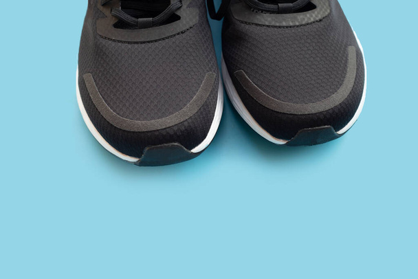 Sneakers shoes on blue background. - Фото, зображення