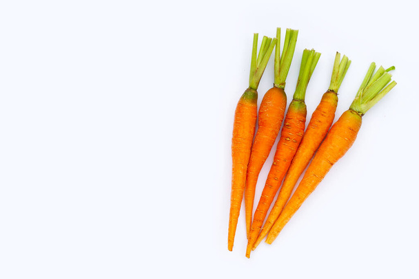 Fresh carrots on white background. - Foto, afbeelding