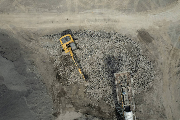 aerial view of excavator scooping rock - Photo, Image