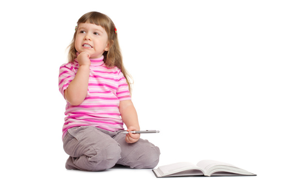 Маленька усміхнена дівчинка з книгою
 - Фото, зображення