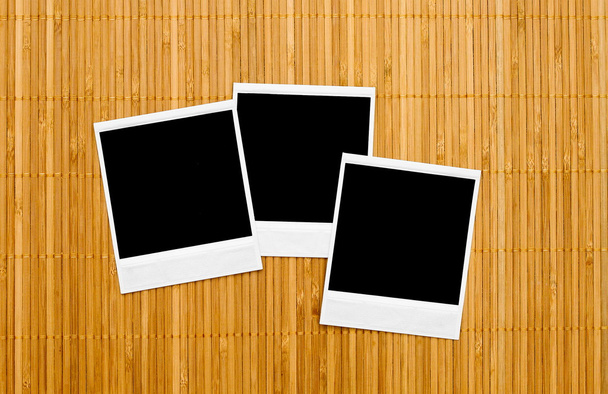 Blank photo frames on bamboo - Foto, Imagem
