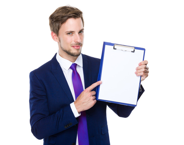 Businessman with finger point to clipboard - Photo, image