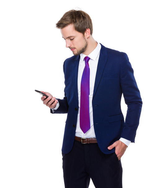 Businessman using mobile phone - Fotó, kép