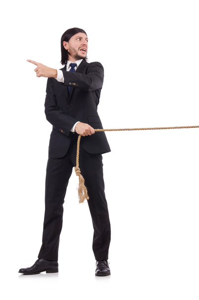 молодий бізнесмен тягне мотузку ізольовано на білому
 - Фото, зображення