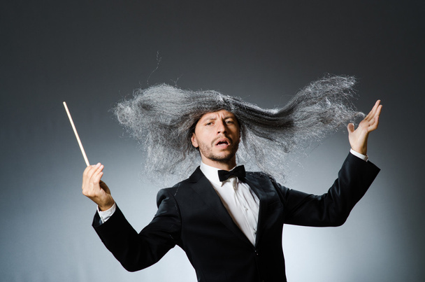 Funny conductor with grey hair - Foto, Imagen