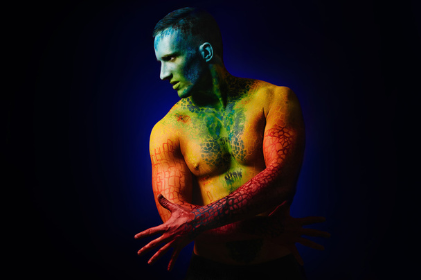 Muscle man with fantasy body art - Foto, Imagem