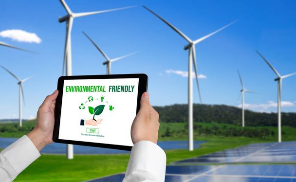 Green Business Transformation für Umweltschutz und ESG-Geschäftskonzept. Geschäftsmann setzt sich mit Tablet Unternehmensziel in Richtung umweltfreundliches Management und alternative Nutzung sauberer Energien. - Foto, Bild