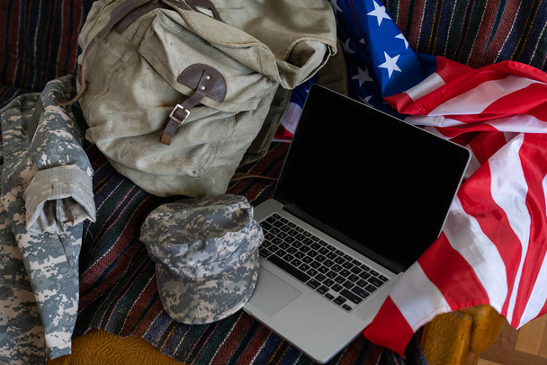 American flags with laptop. military cap. - Foto, imagen