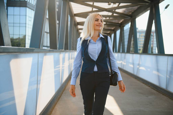 Beautiful Woman Going To Work, Business Woman Walking Near Office Building. Portrait Of Successful Business Woman - Foto, Imagen