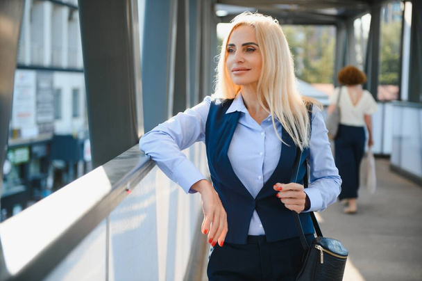 Portrait of business woman smiling outdoor. - Photo, Image