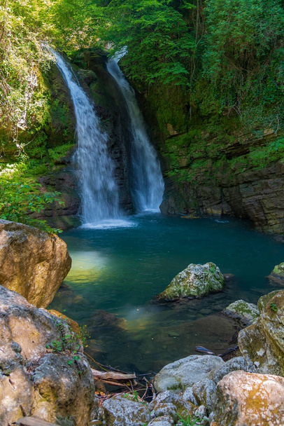 In the heart of a very small village in Molise, immersed in an enchanted forest and floral nature, stands the Carpinone waterfall, one of the most fascinating spectacles of the local nature. - Photo, Image