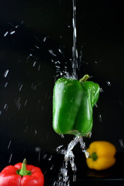 close up of fresh green pepper and water flow - Fotoğraf, Görsel