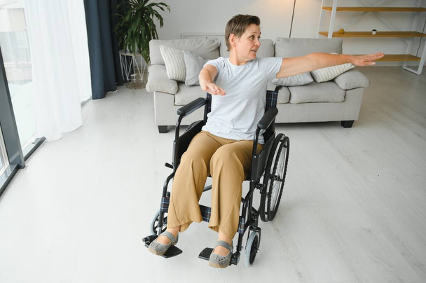 Senior woman on a wheelchair. - Фото, изображение